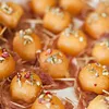 Salami Wrapped Melon With Candied Fennel, Coriander and Pink Peppercorns